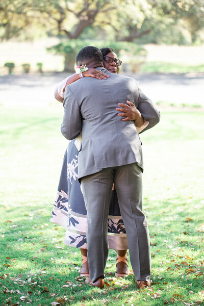 Mother and son wedding day first look