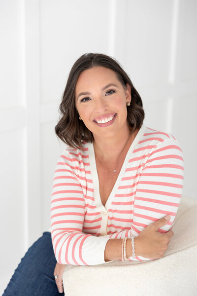 headshot of a woman sitting casually in a casual outfit