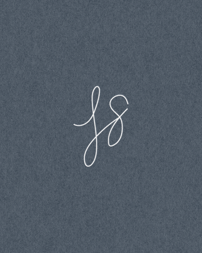 Custom monogram design for Joelle Suess, a podcast manager, featuring elegant hand-drawn initials on a navy textured background.