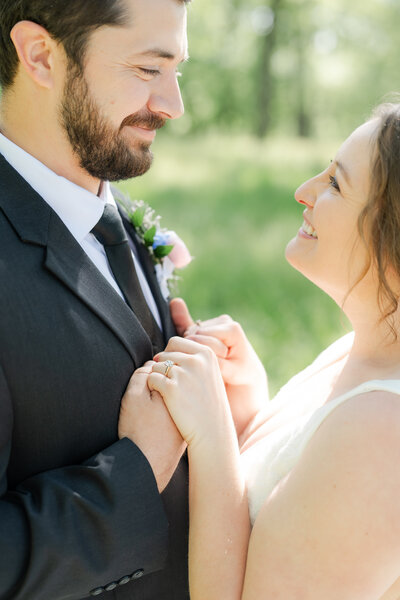 bride and groom share a kiss in front of church steps