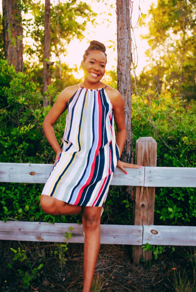 Valrie Grant in Striped Dress Smiling