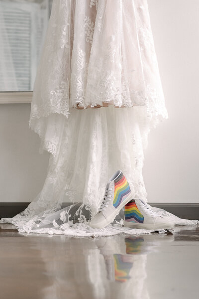 LGBTQ+ safe vendor autumn and hive wedding dress with rainbow shoes