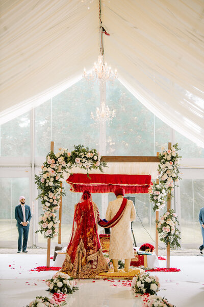 A Sikh bride and groom stand at the altar during their wedding ceremony in Cincinnati Ohio