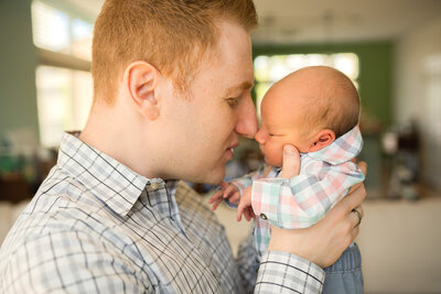 cleveland newborn baby being held by mom and dad