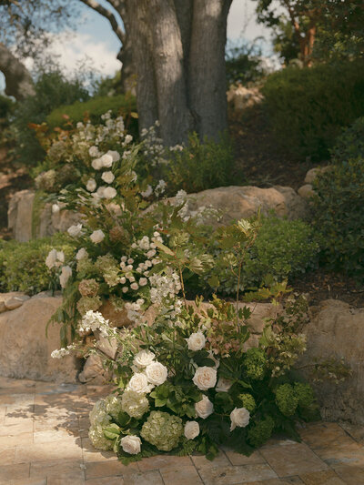 White and Green ceremony florals with hydrangeas at Rava Wines by Precious and Blooming in Paso Robles 