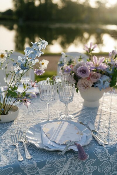 lilac and blue centerpiece  on a wedding table
