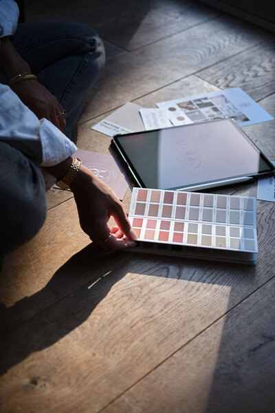 Hand holding colour swatches