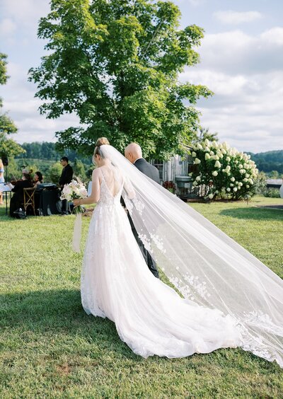Picture of wedding photographer in Virginia holding camera.