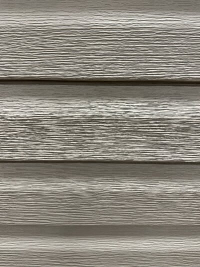A close up of dutch lap vinyl siding installed by Perry Vinyl Windows & Doors in Hazard, Kentucky