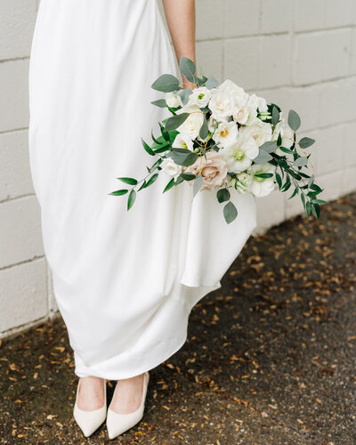 Bride holding wedding bouquet photo artistic