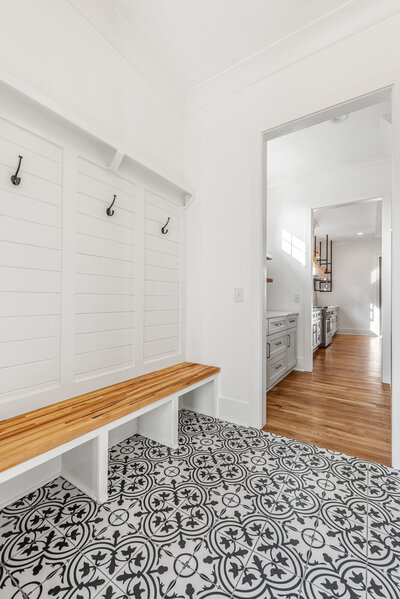 Black and white mudroom design in a custom new build. Design by Gracious Home Interiors in Waxhaw, North Carolina.