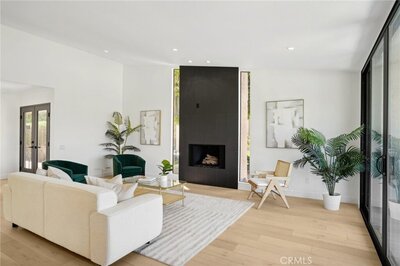 Photo of living room with black fireplace home staging