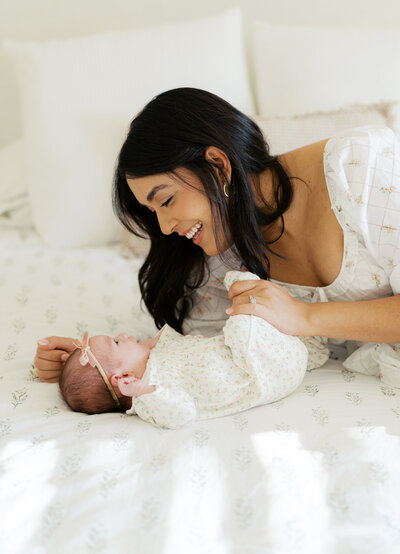 mom and dad holding new baby