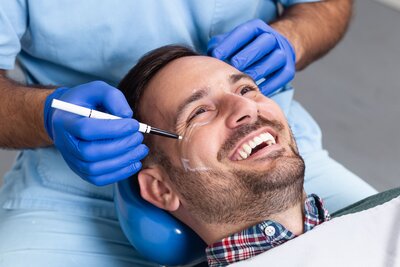 Male getting botox service