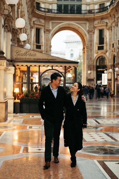 A couple is strolling around the vibrant streets of Milan while I capture their love story with a honeymoon photoshoot service