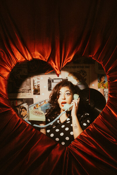Heart framed woman on the phone