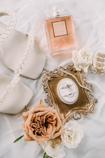 bridal details of wedding rings and shoes