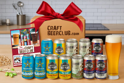 A collection of craft beer in front of a Craft Beer Club gift box. 