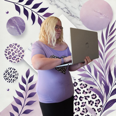 The owner of Marie Gems Digital is standing while working on a laptop. She is wearing a purple shirt with a leopard print heart design and glasses. In the background, there is a shelf displaying various colorful tumblers, books, and jars, adding a creative and business-focused atmosphere to the scene.