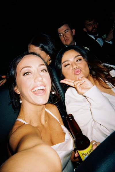 Flash photo of bridesmaids taking a selfie