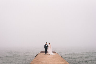 bride-and-groom-elder-lane-beach-pier-winnetka
