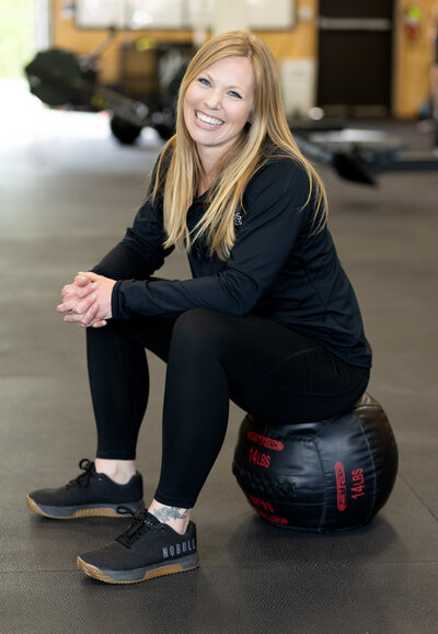 Gym members working out together at Skopos Athletics in Dundas, MN during Bring a Friend Day, enjoying a fun and motivating group fitness experience.