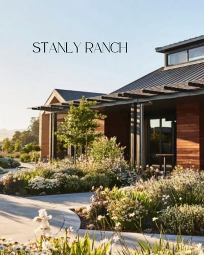Floral-lined pathway and modern ranch architecture at Stanly Ranch, a chic Napa wedding venue for stylish couples.