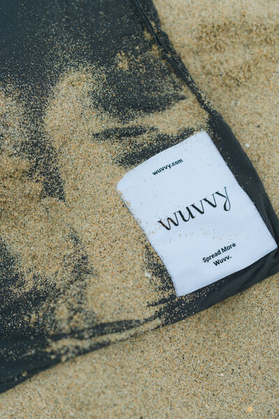 blanket brand photoshoot, cozy branding photoshoot on the beach