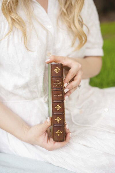 woman holding an old book