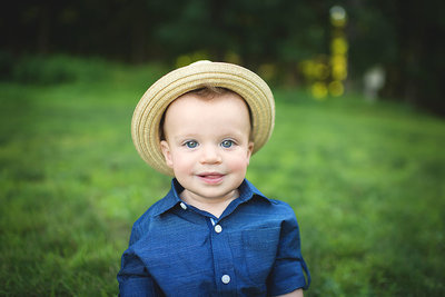 6 month Baby boy in a basket smiling CT baby infant milestone photographer Elizabeth Frederick Photography