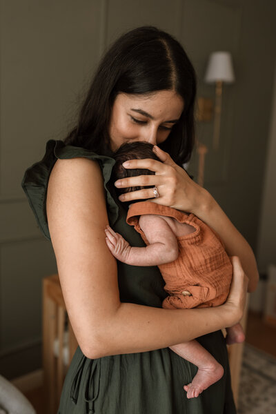 mom holding newborn baby