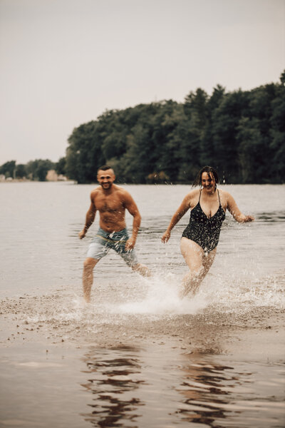 A splash through the lake for this fun couple's photoshoot in Wisconsin.
