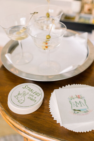 Cocktails with personalized coasters and custom wedding napkins