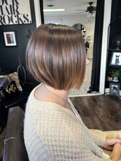 woman getting hair shampooed in salon