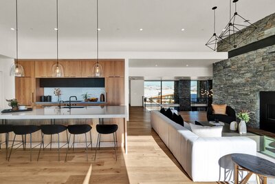 Modern kitchen and living room of Glenwild Getaway project by Utah interior designer Chalet + Co.