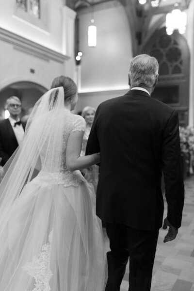 Bride walking down the aisle with her father