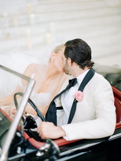 Groom giving the bride a kiss