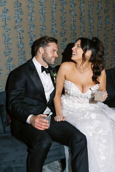 cheers to the bride and groom during a luxury wedding reception overlooking the ocean