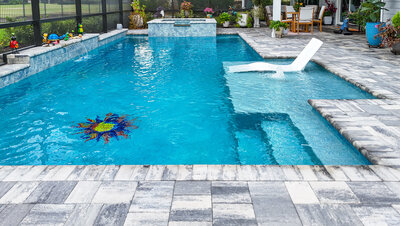 Luxury North Florida custom backyard with pool and outdoor kitchen by Southern Outdoor Spaces