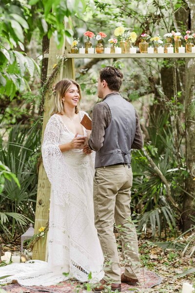 Couple exchanges vows at an altar in Florida woods