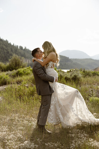 photo of bride and groom at their wedding ceremony standing with their efficient taken by Elopement photographer in telluride