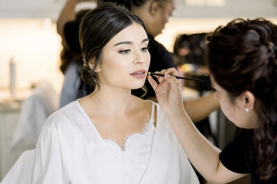 Bride getting make up done at private residence in Roswell, GA. Photo taken by Chicago + Atlanta Photographer Ella Grace Richards of Forever Love Photography 
