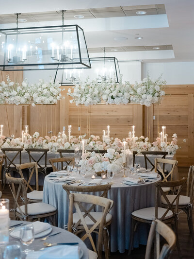 indoor luxury wedding reception with white florals
