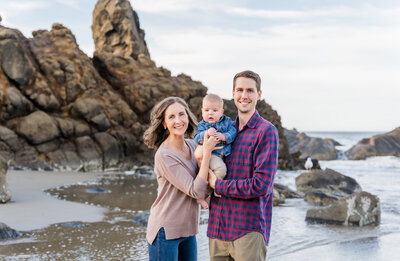 Family snuggled up for photos by Lincoln City, Oregon