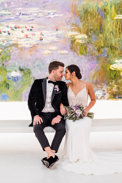 Bride and groom embrace on dock at Riverfront Wedding Venue in Pittsburgh PA