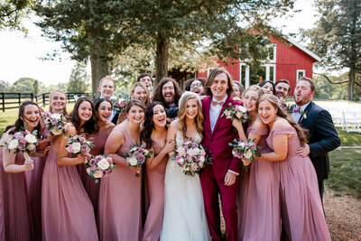 Pink and Burgundy Wedding Party in front of barn at Cedarmont