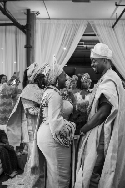 A Nigerian couple laughs together at the wedding at Terminus 330 in Atlanta, Georgia