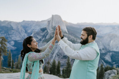 bride and groom embracing on mountain