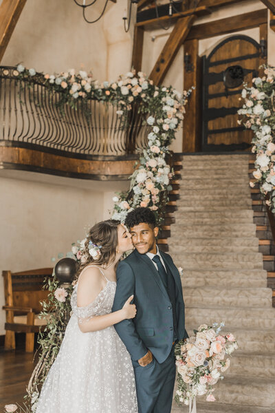 Wedding Photographer & Elopement Photographer, bride and groom kissing in front of staircase