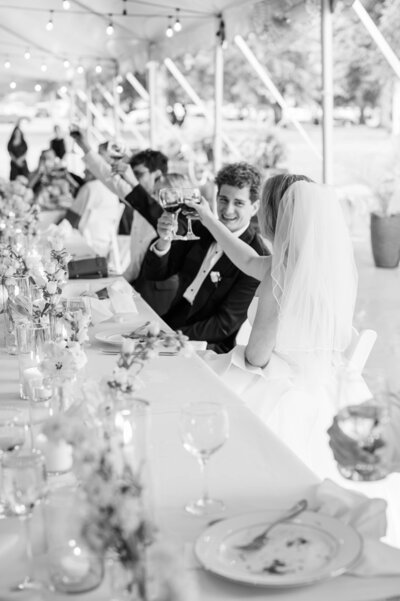 Bride puts on her dress and shoes on her wedding day at the Jim Beam Distillery